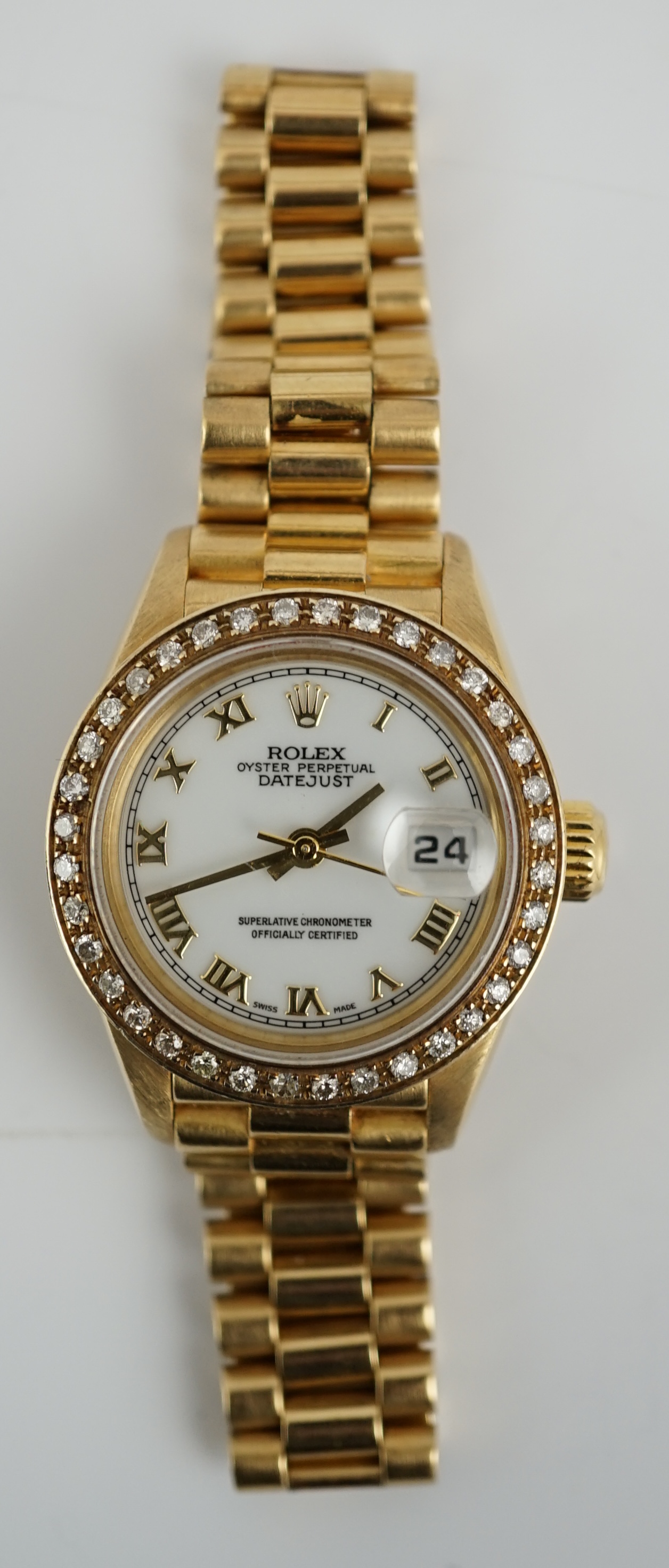 A lady's 1990's 18ct gold Rolex Oyster Perpetual Datejust wrist watch, with after market diamond set bezel